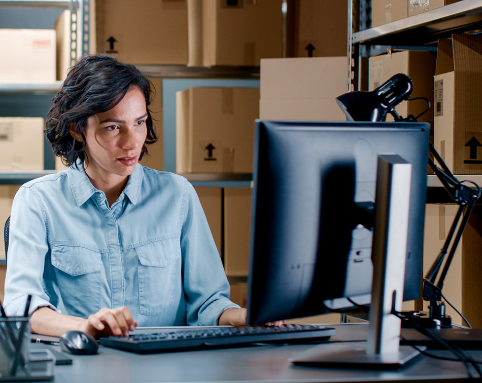 Woman sitting and working in front of a computer monitor Managers can quickly file electronic incident reports.