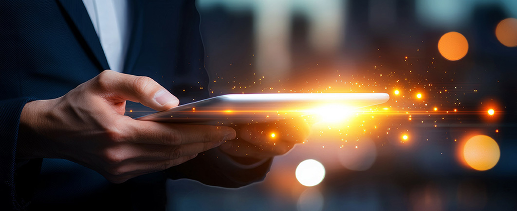 Person holding a tablet with illuminated information 