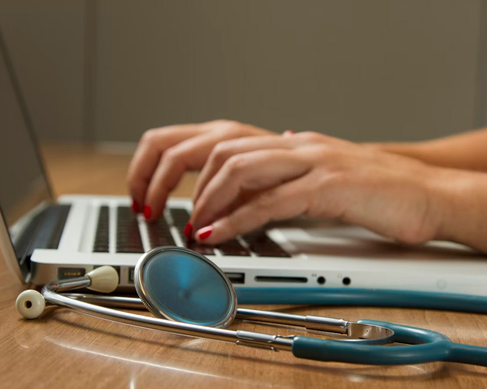 Healthcare worker at a computer